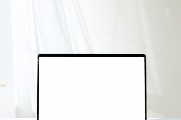 Modern office workspace with computer displaying trading platform interface
